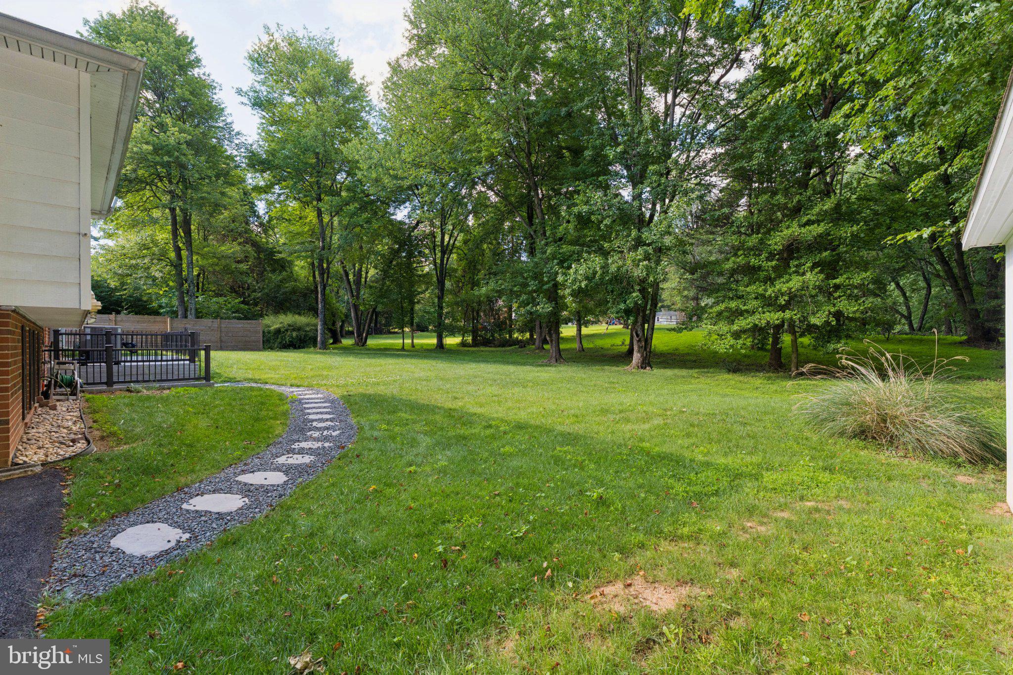 3219 Fox Mill Road Oakton, VA 22124 - Photo 72 of 87 Lush green retreat with winding path.