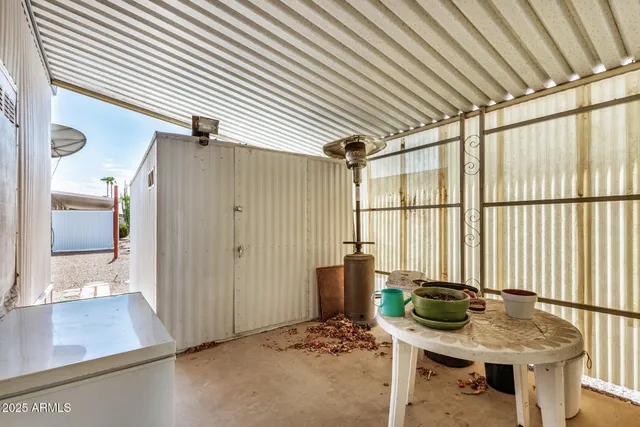 a dining room with furniture and a window
