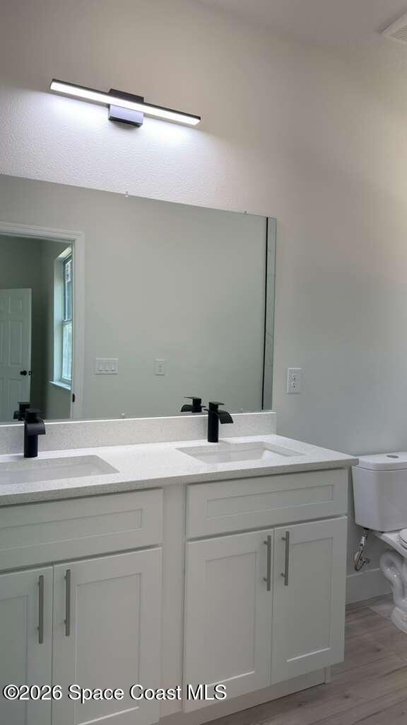 1091 Wing Road Southwest Palm Bay, FL 32908 - Photo 18 of 21 a bathroom with a sink vanity granite and a mirror
