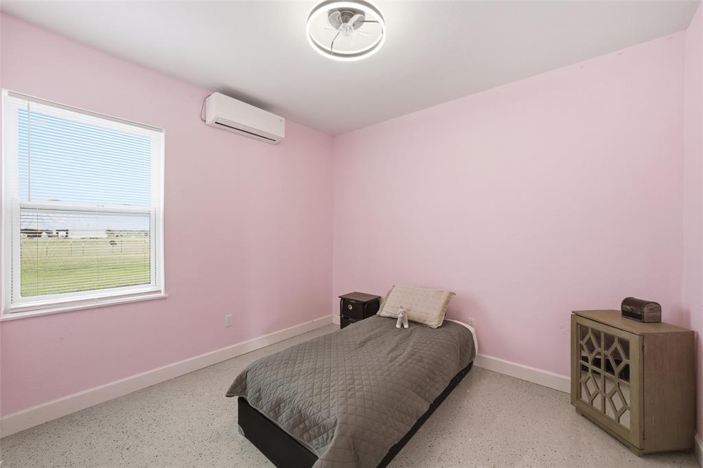 151 Kasberg Road Leroy, TX 76691 - Photo 14 of 40 a bedroom with a bed and a window