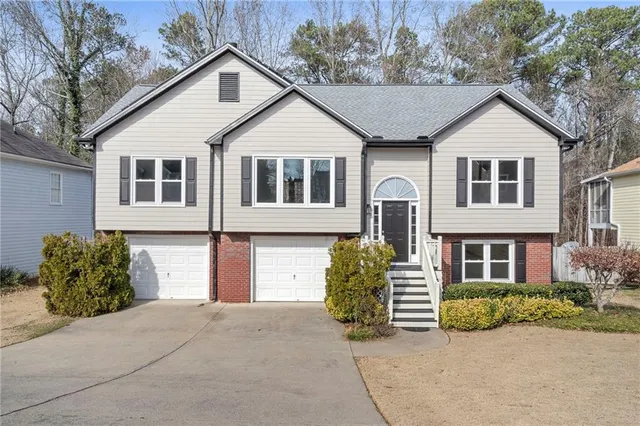 a front view of a house with garden