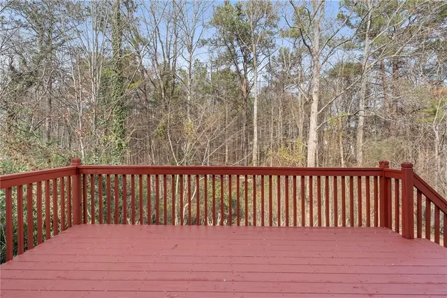a view of balcony with wooden floor
