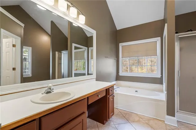 a bathroom with a bathtub and a sink