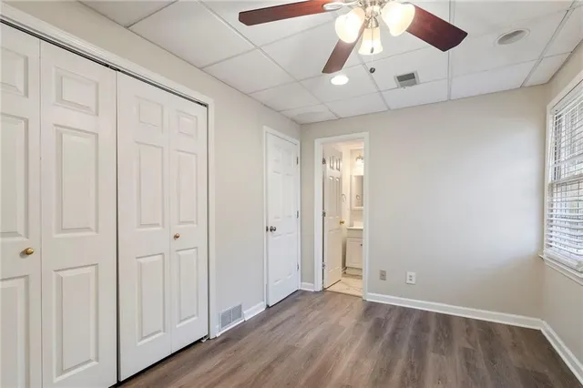 a bathroom with a sink toilet vanity and shower