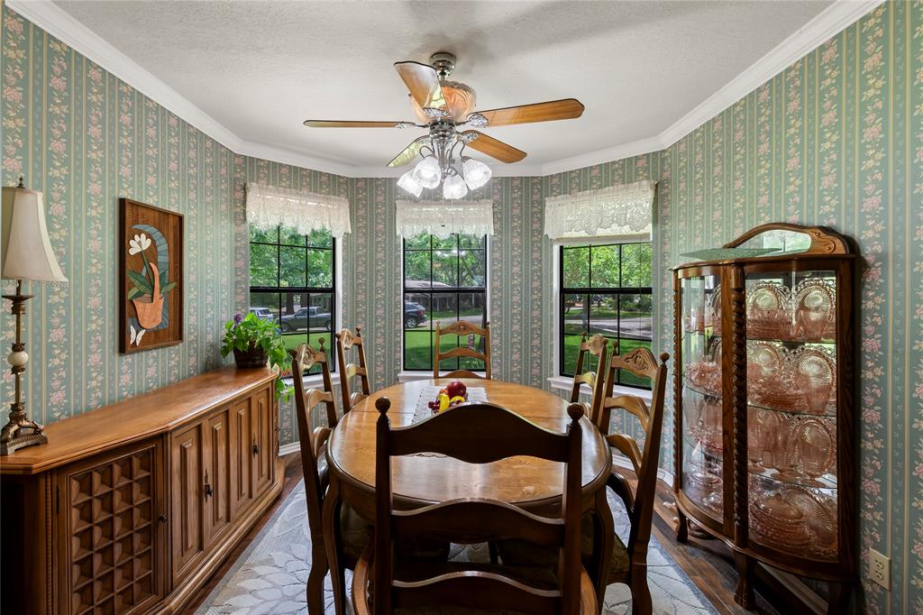 455 Stirrup Ranch Road Trinidad, TX 75163 - Photo 9 of 20 a dining room with furniture a chandelier and wooden floor