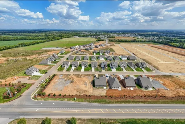 an aerial view of a house with outdoor space