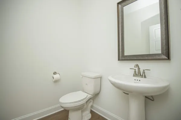 a view of staircase with white walls and a window