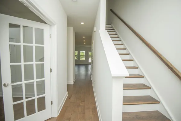 a view of staircase with white walls and white walls