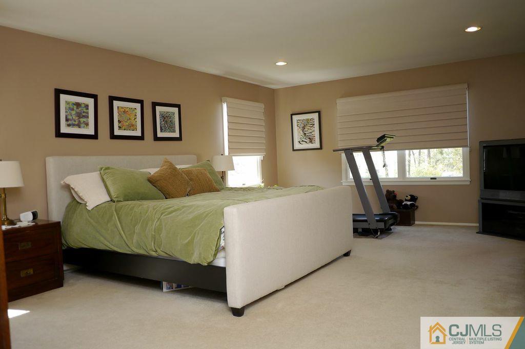 14 Bradford Road Edison, NJ 08820 - Photo 7 of 20 a bed room with a bed and a couch