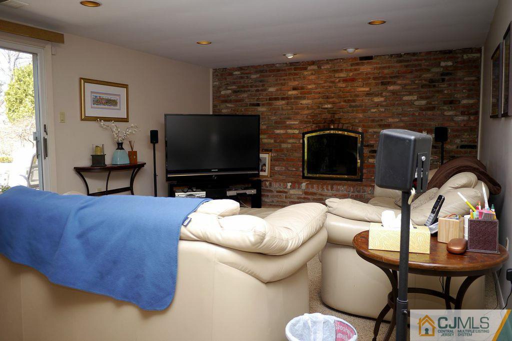 14 Bradford Road Edison, NJ 08820 - Photo 8 of 20 a living room with furniture and a flat screen tv