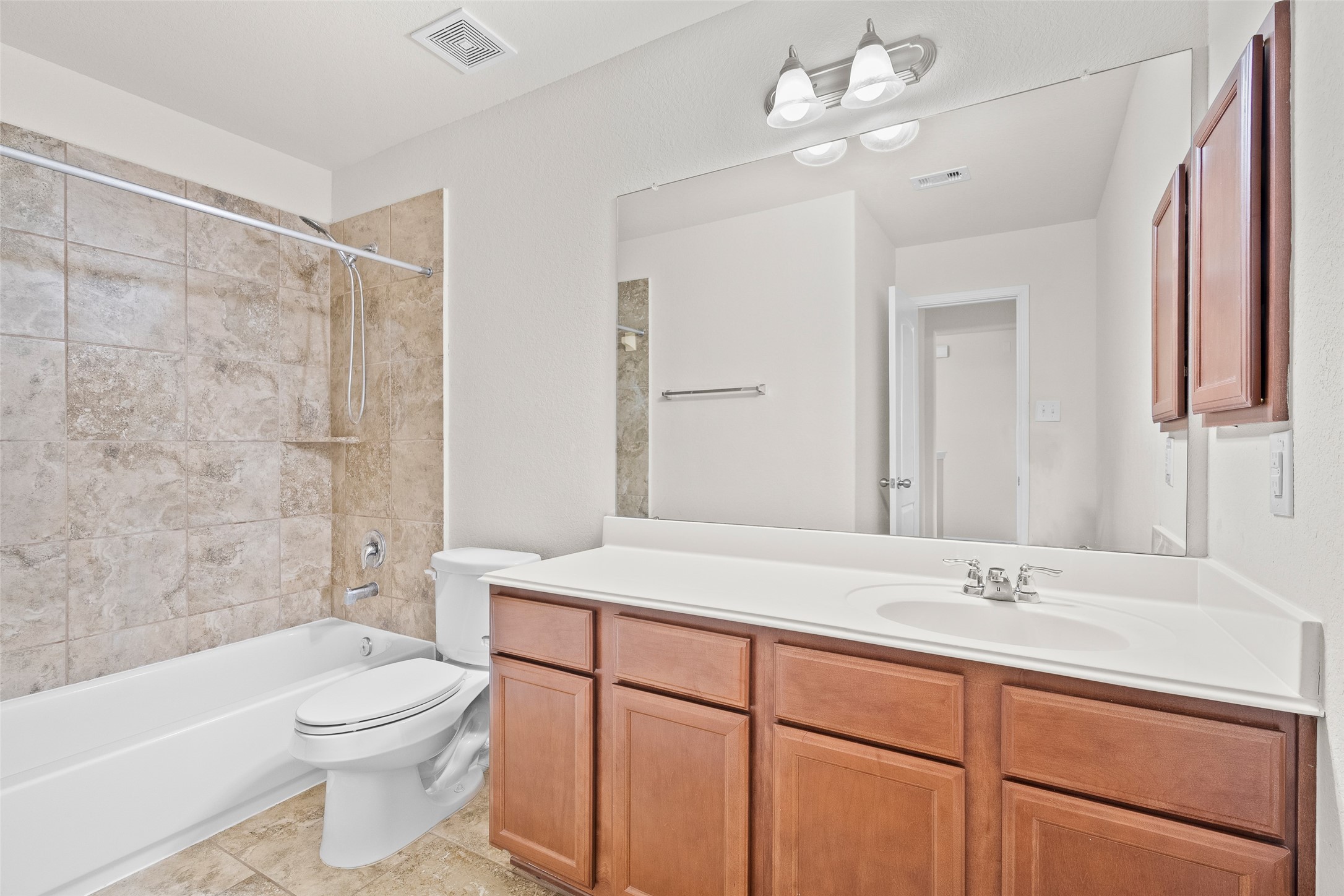 3326 Coopers Ridge Way Houston, TX 77084 - Photo 12 of 17 a bathroom with a sink a toilet and shower