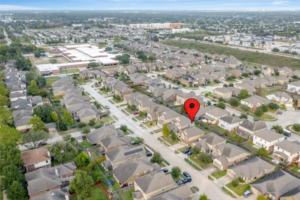 an aerial view of residential houses with outdoor space