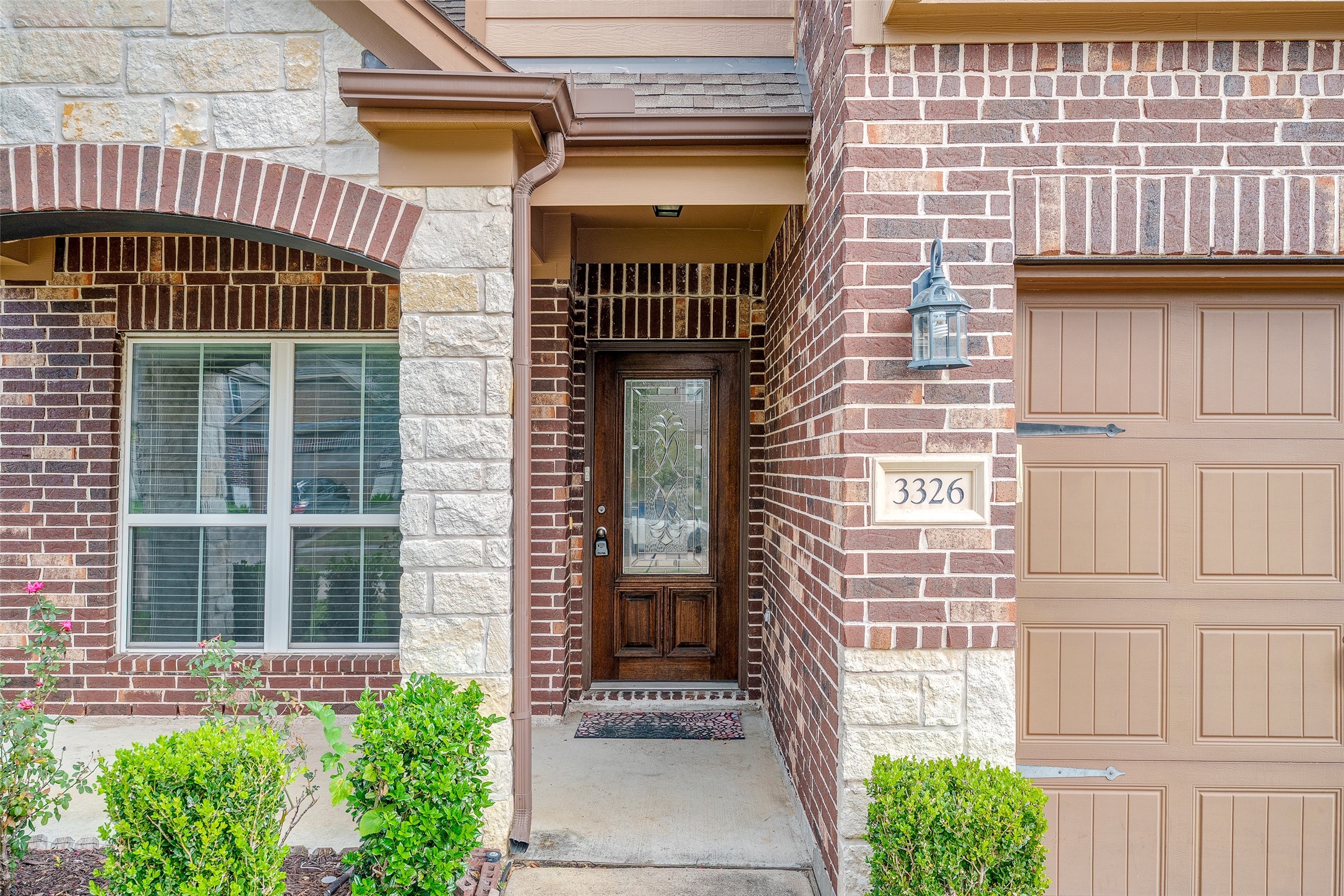3326 Coopers Ridge Way Houston, TX 77084 - Photo 2 of 17 a front view of a house with a window