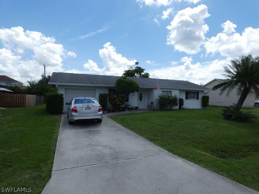 18555 Geranium Road Fort Myers, FL 33967 - Photo 1 of 25 a view of a house with a back yard