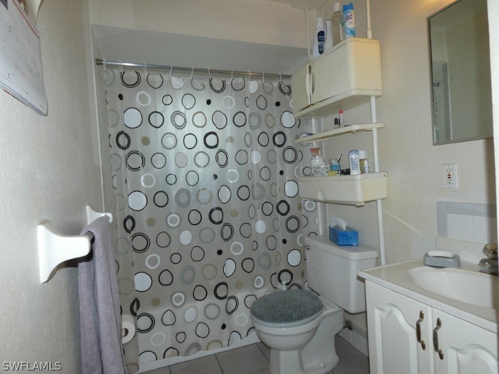18555 Geranium Road Fort Myers, FL 33967 - Photo 13 of 25 a bathroom with a sink toilet and shower