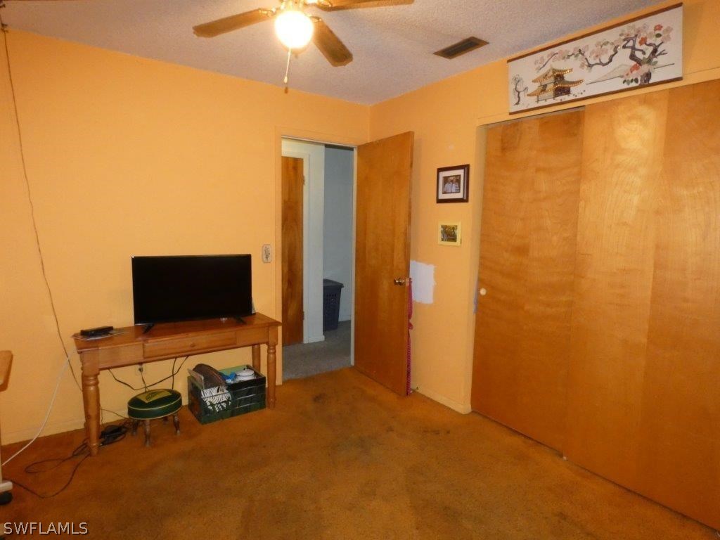 18555 Geranium Road Fort Myers, FL 33967 - Photo 15 of 25 a view of a livingroom with a tv