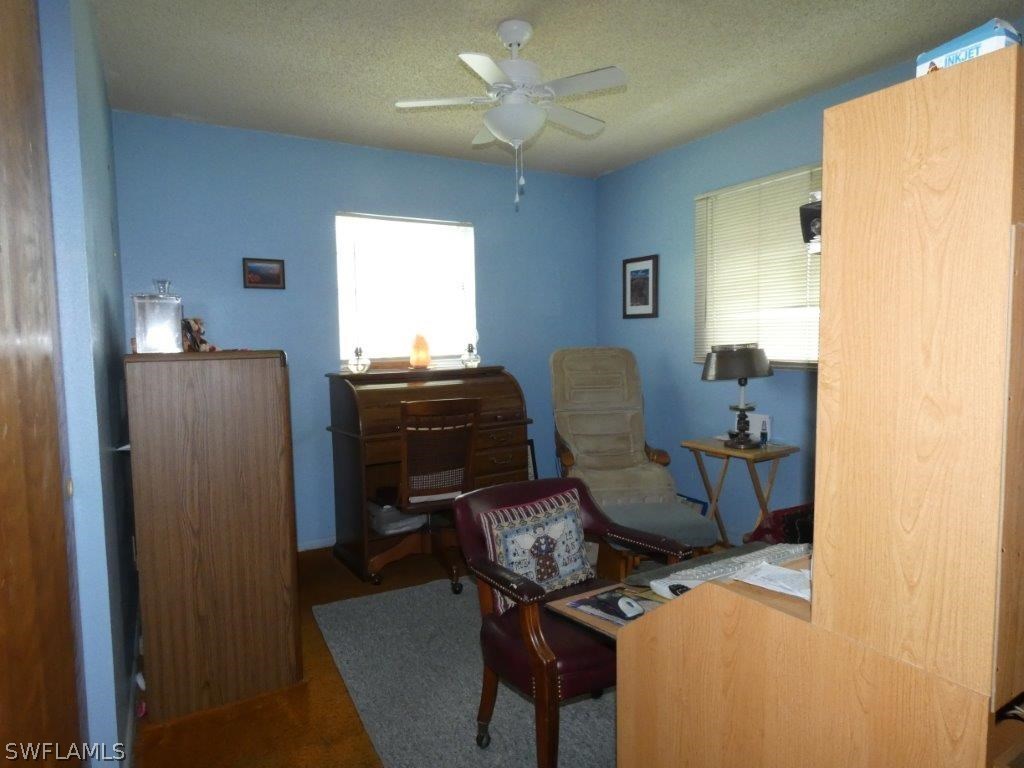 18555 Geranium Road Fort Myers, FL 33967 - Photo 19 of 25 a view of workspace with wooden floor windows