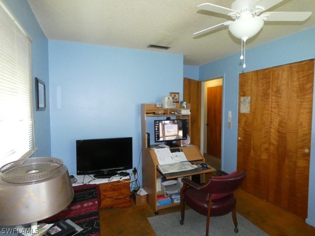 18555 Geranium Road Fort Myers, FL 33967 - Photo 20 of 25 a view of a workspace with furniture and a window