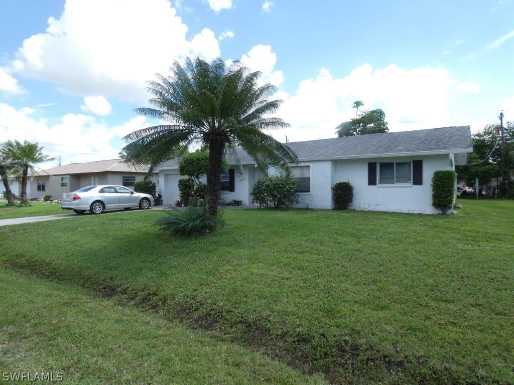 18555 Geranium Road Fort Myers, FL 33967 - Photo 2 of 25 a front view of house with yard and green space