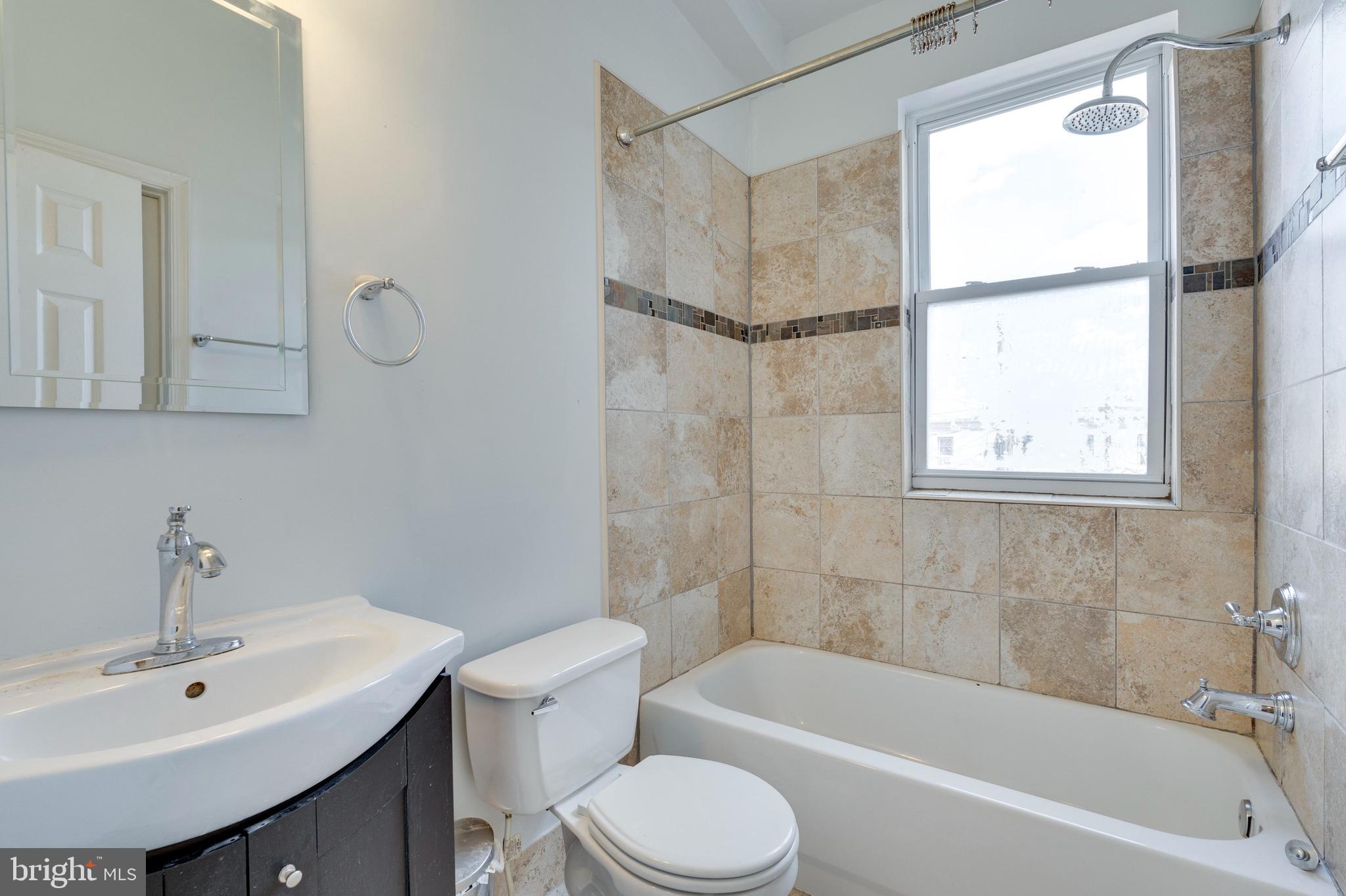 3017 Warder Street Northwest Washington, DC 20001 - Photo 12 of 14 a bathroom with a sink mirror toilet and bathtub
