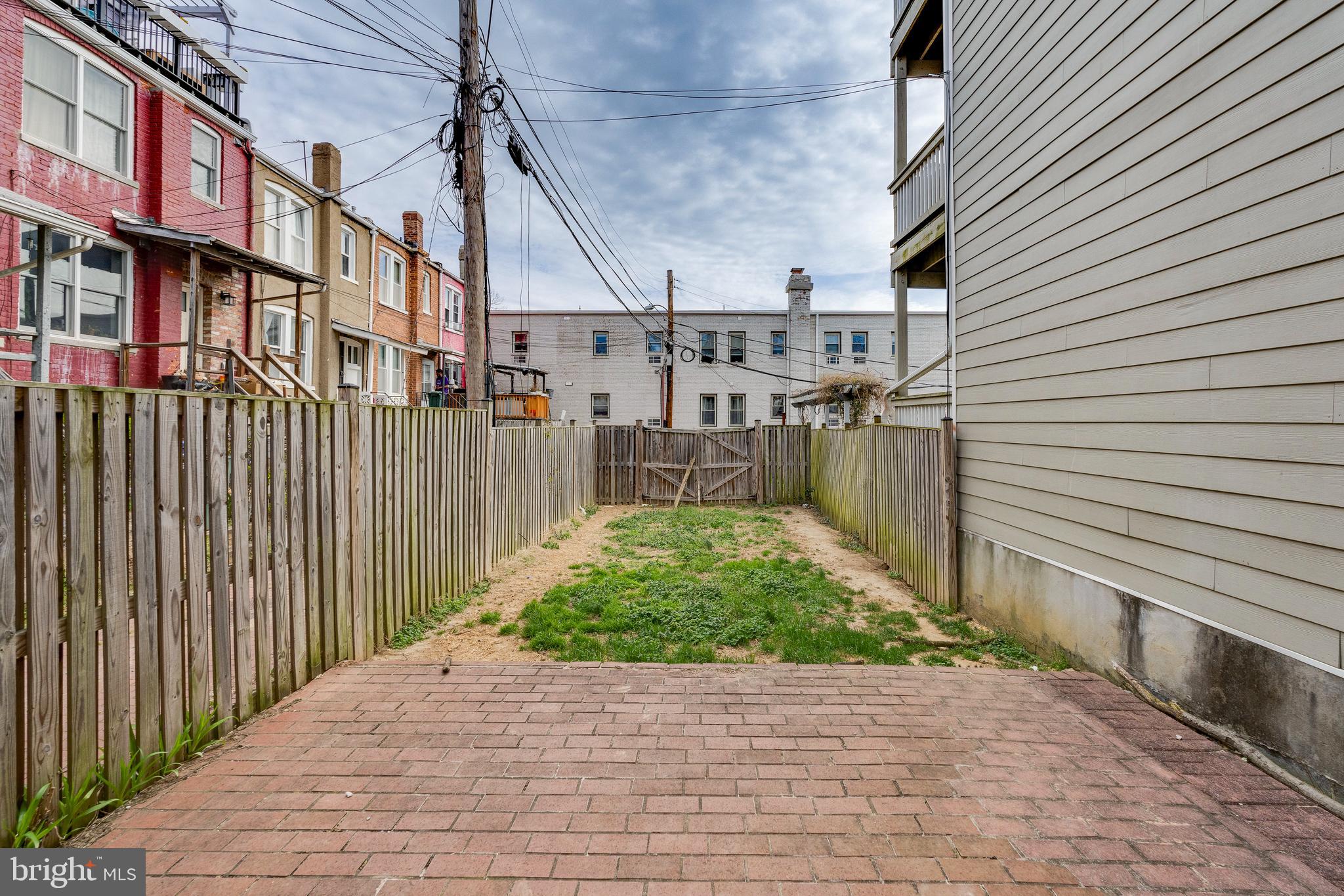 3017 Warder Street Northwest Washington, DC 20001 - Photo 14 of 14 a view of a pathway both side of house