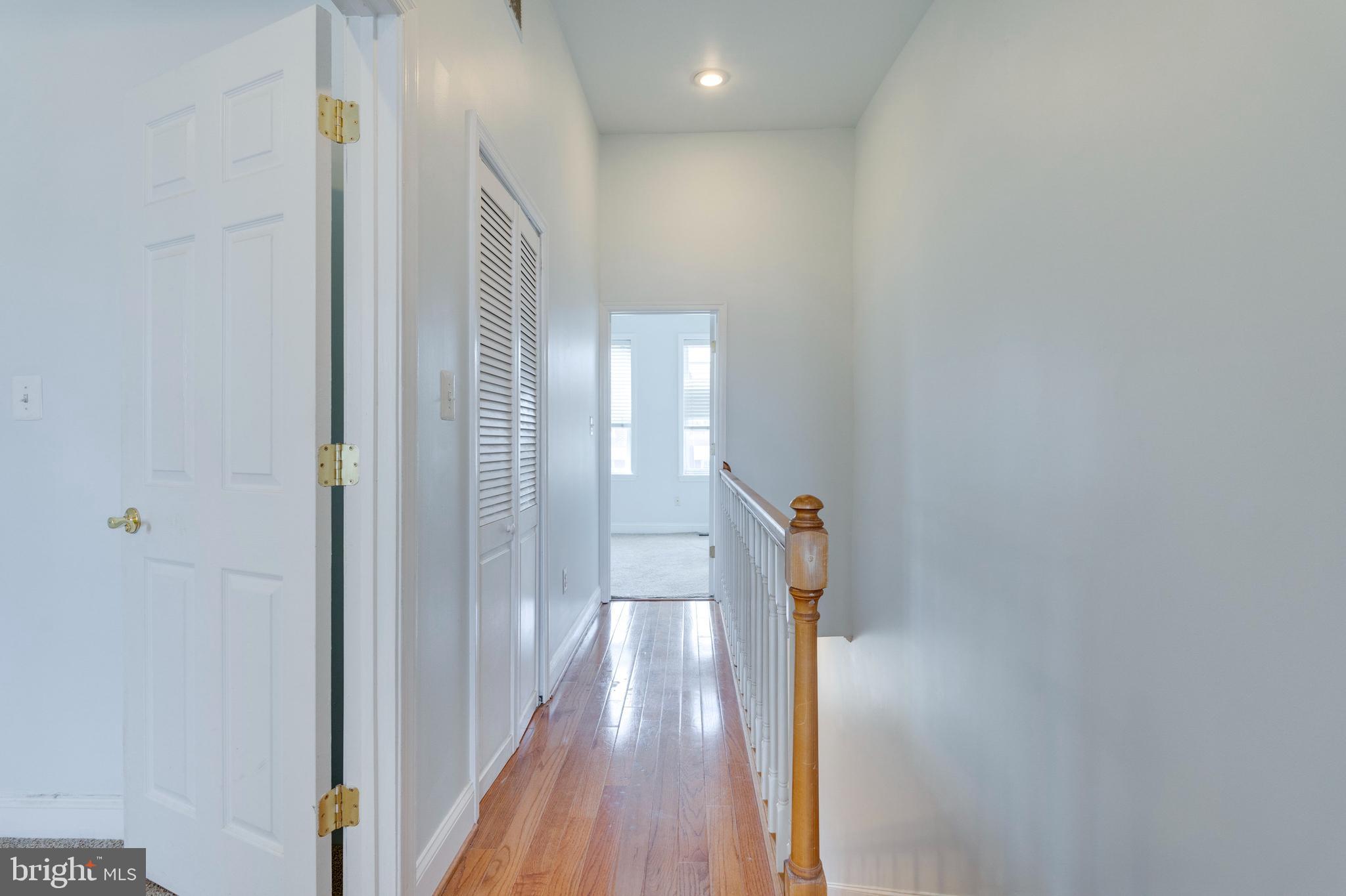 3017 Warder Street Northwest Washington, DC 20001 - Photo 6 of 14 a view of a hallway with wooden floor