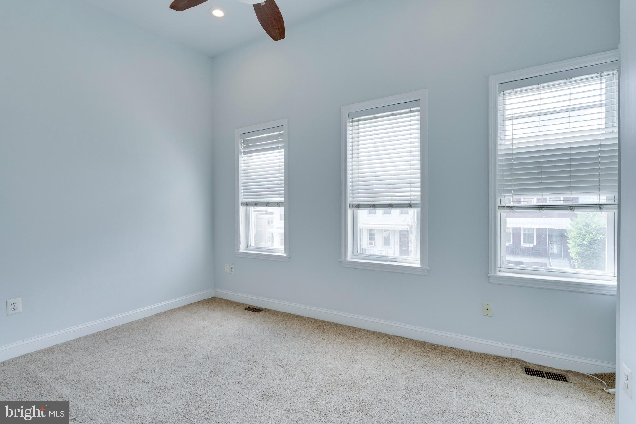 3017 Warder Street Northwest Washington, DC 20001 - Photo 10 of 14 an empty room with windows