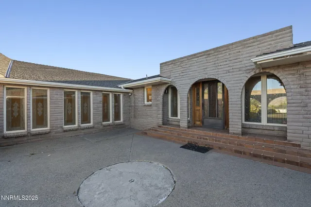 a view of a house with large windows