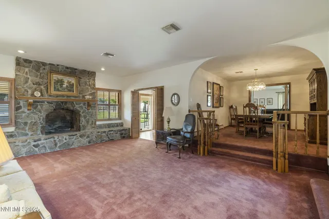 a view of livingroom with furniture and a fireplace