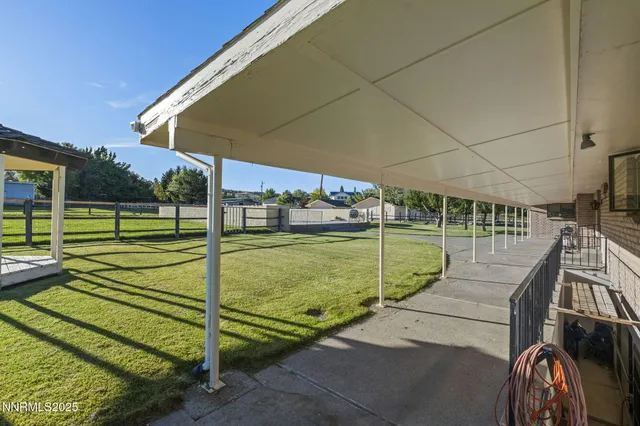 a view of a backyard with swimming pool