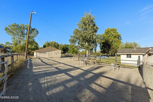 a view of a patio with swimming pool