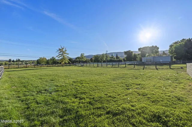 a view of a large building with a big yard