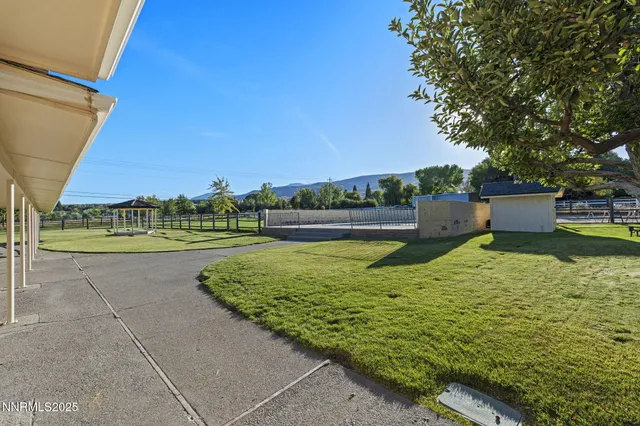 a backyard of a house with lots of green space