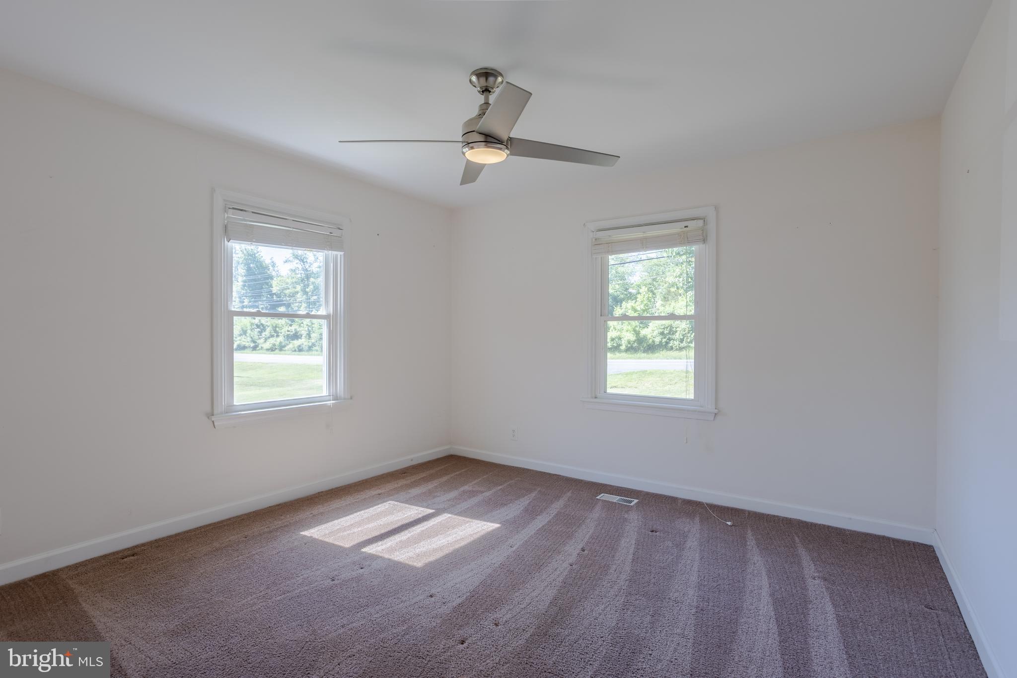 3612 Churchville Road Aberdeen, MD 21001 - Photo 15 of 49 a view of empty room with wooden floor and fan