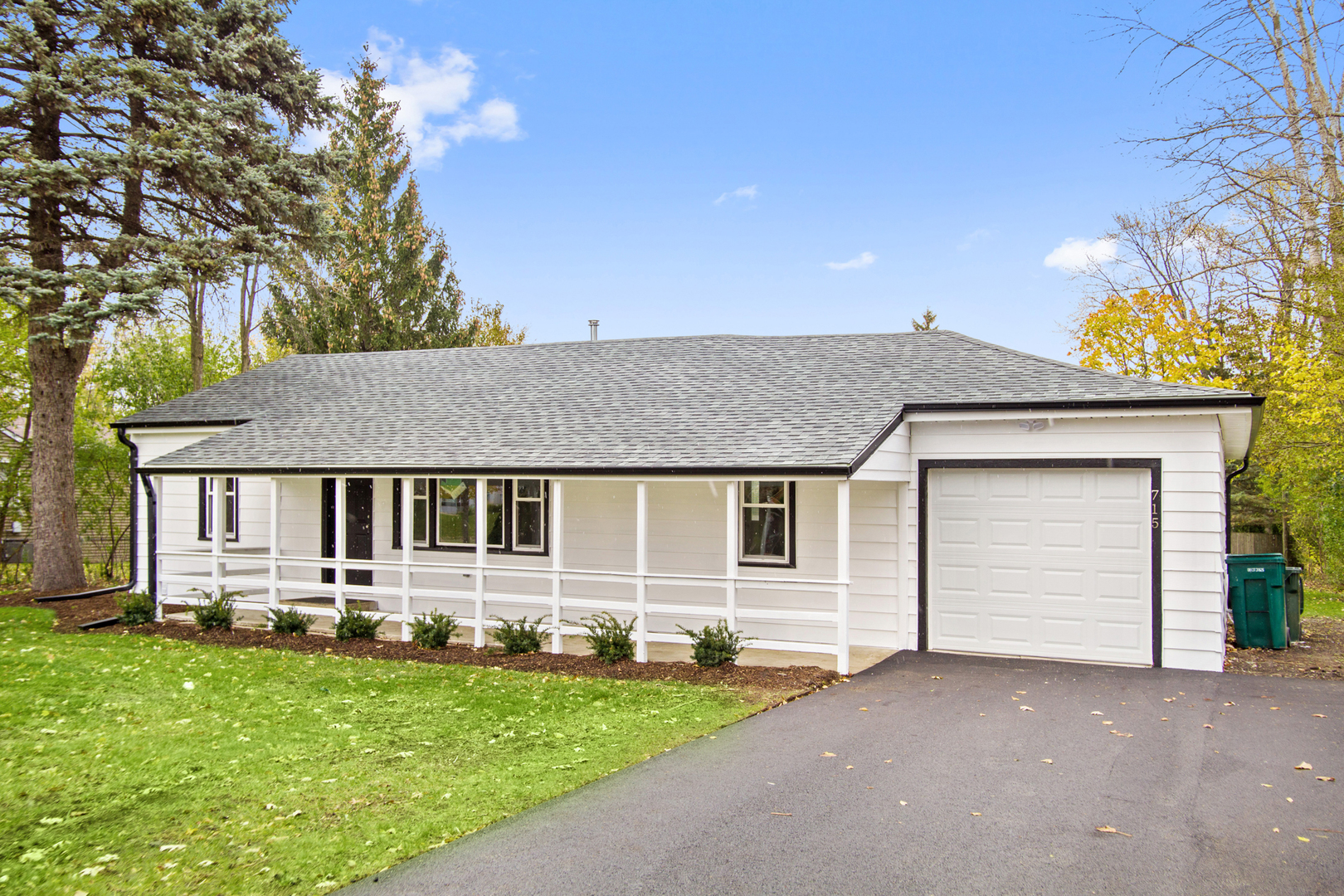 front view of a house with a yard