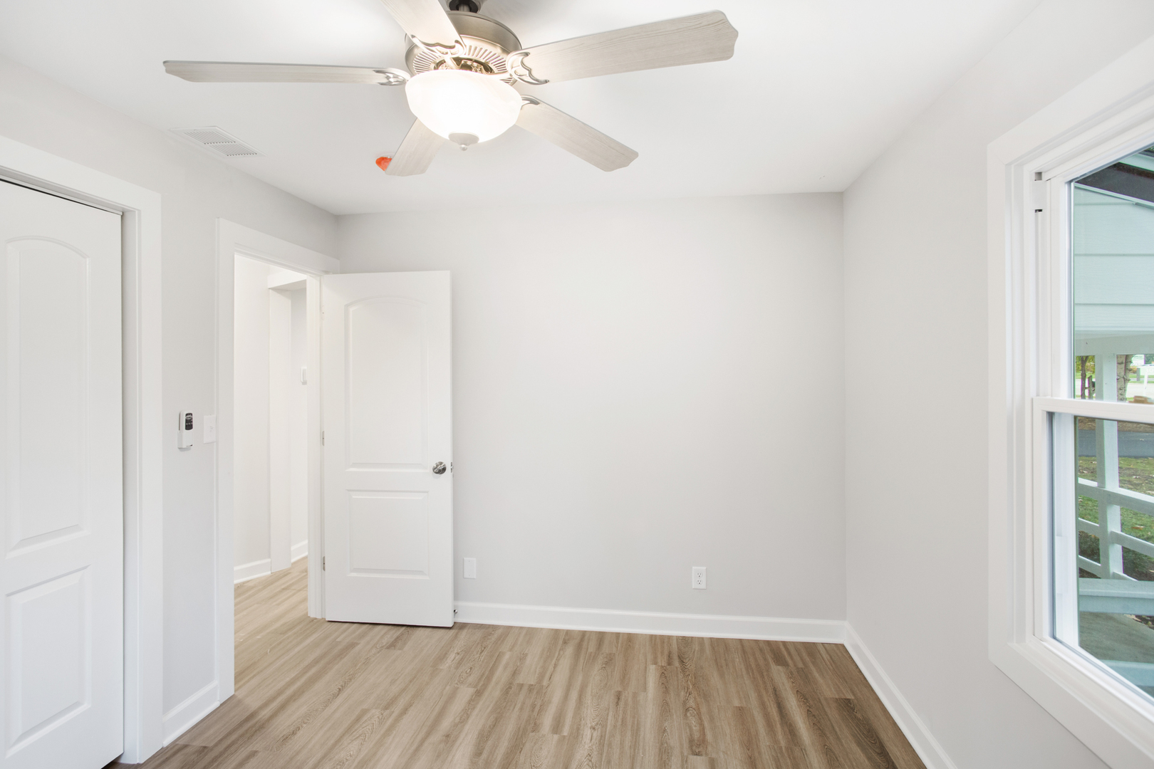 715 Anthony Trail Northbrook, IL 60062 - Photo 11 of 20 wooden floor in an empty room with a window