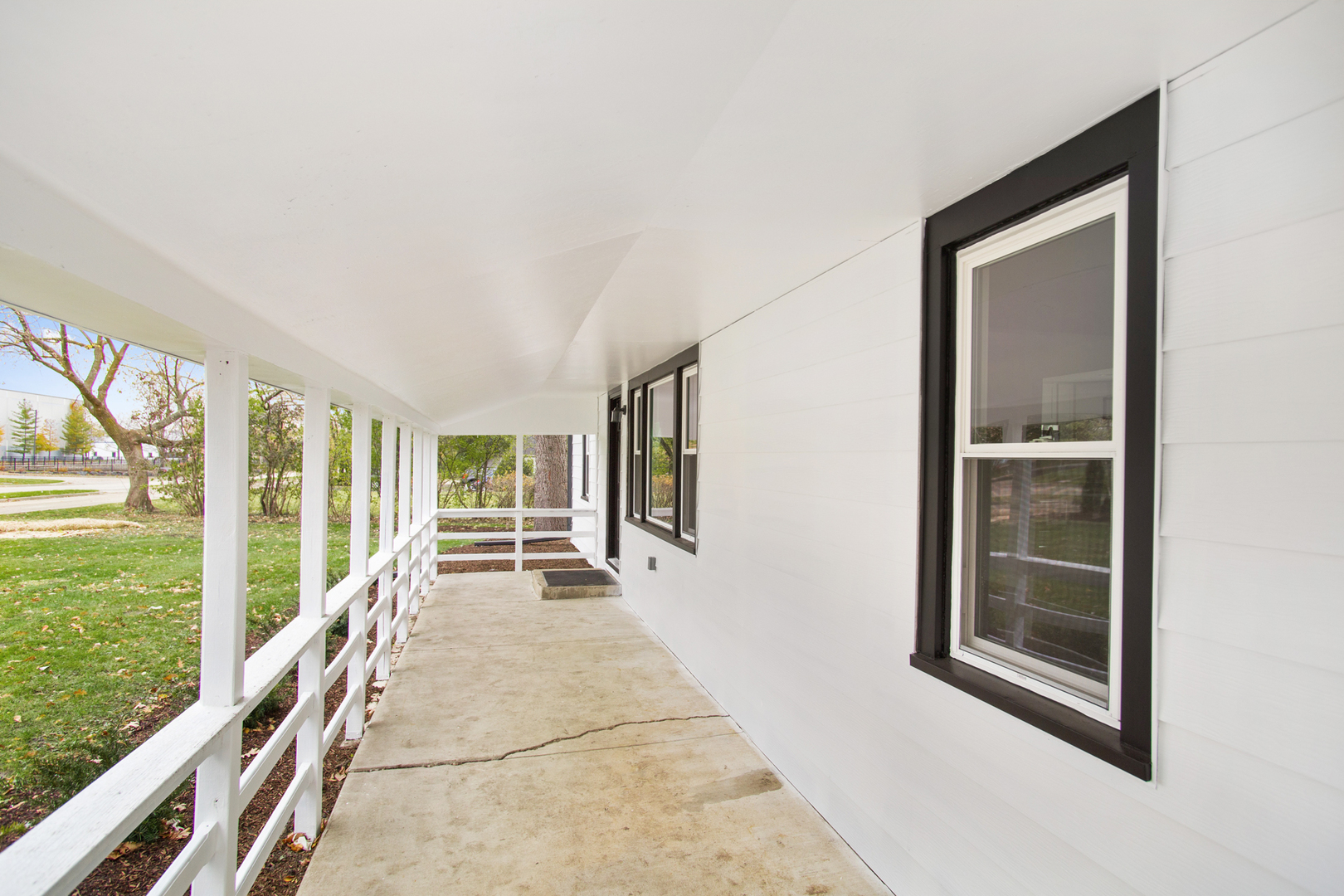 715 Anthony Trail Northbrook, IL 60062 - Photo 17 of 20 a view of an entryway with wooden floor and garden