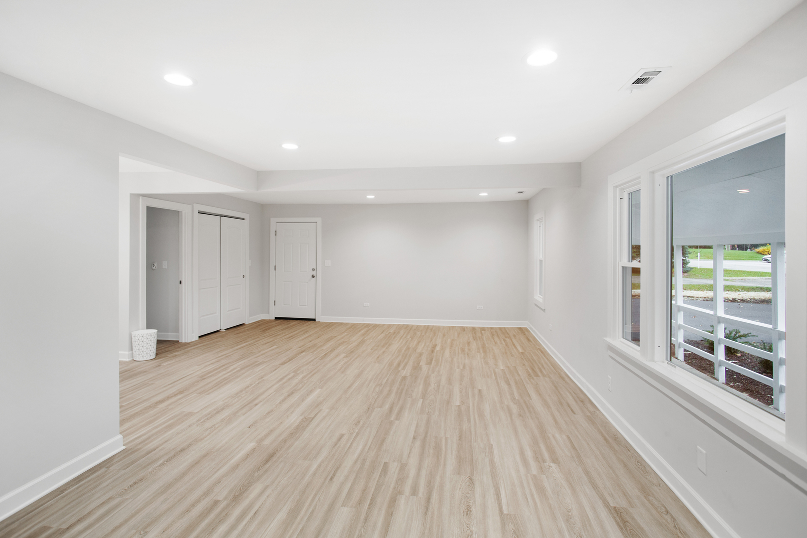 715 Anthony Trail Northbrook, IL 60062 - Photo 4 of 20 wooden floor in an empty room with a window