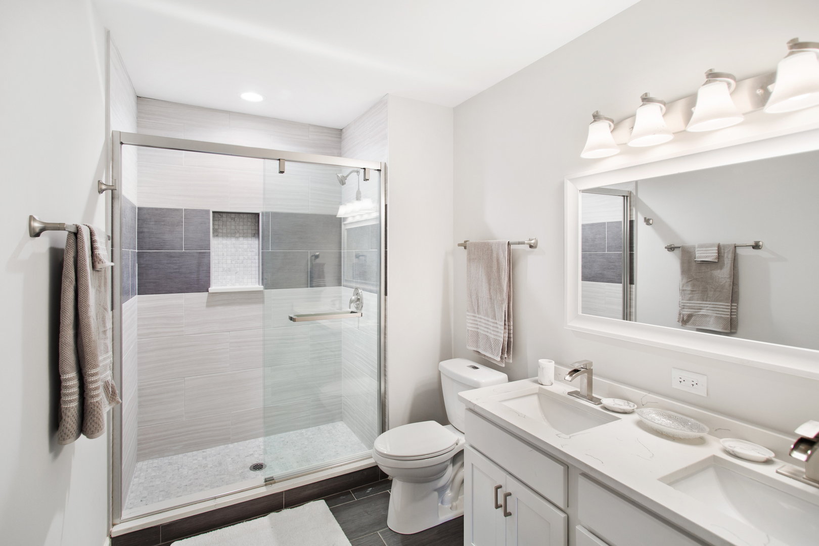 715 Anthony Trail Northbrook, IL 60062 - Photo 9 of 20 a bathroom with a sink vanity mirror and toilet