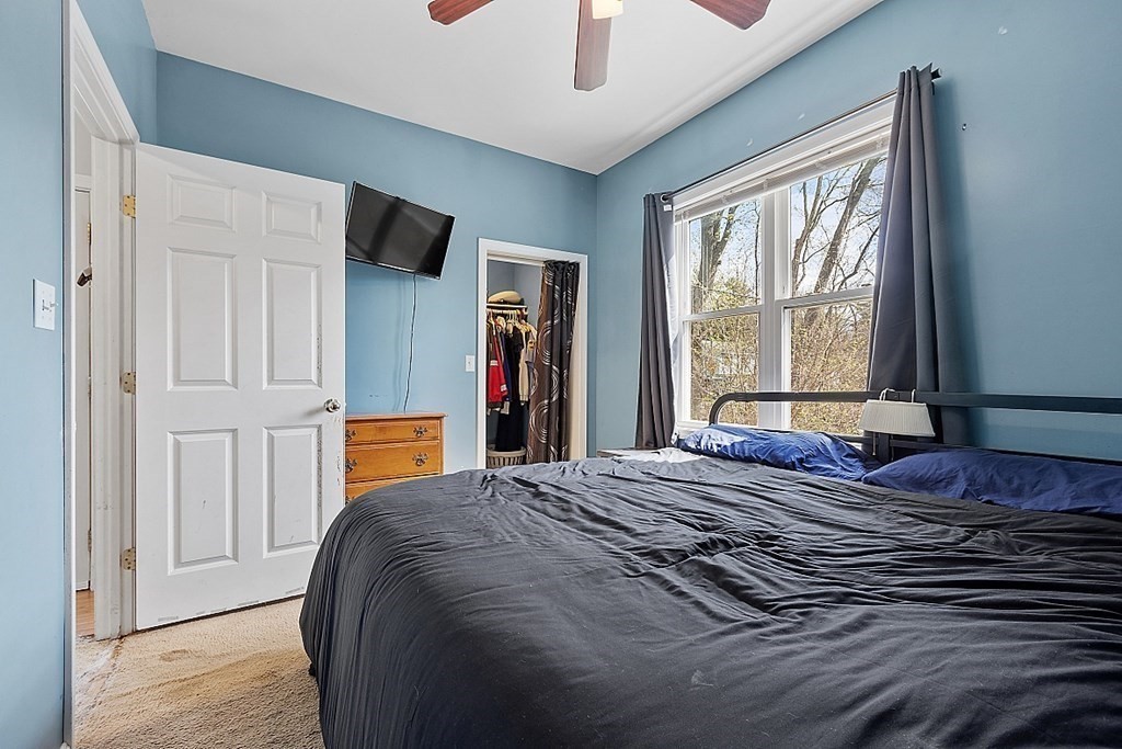 250 Brookside Road Orange, MA 01364 - Photo 11 of 30 a bedroom with a bed and a window