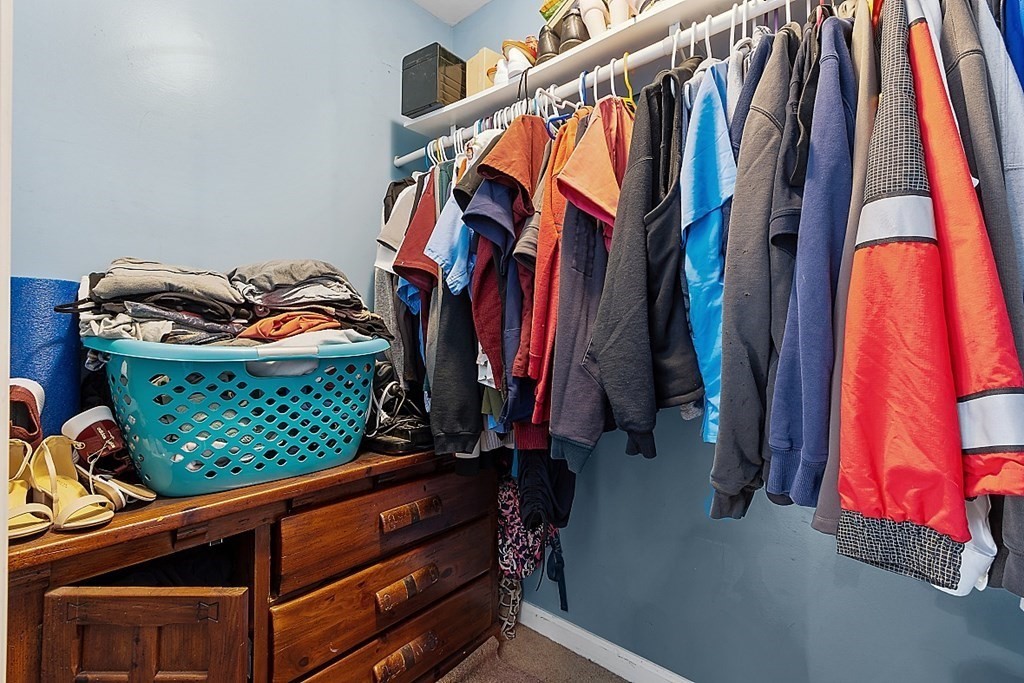 250 Brookside Road Orange, MA 01364 - Photo 12 of 30 a view of walk in closet with clothes and shoes