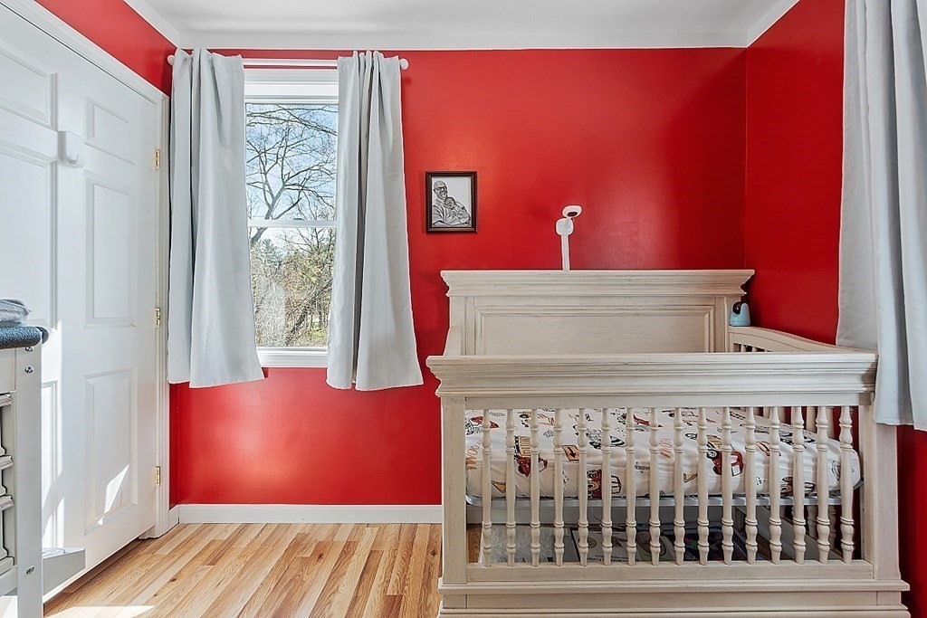 250 Brookside Road Orange, MA 01364 - Photo 19 of 30 a view of a bedroom with wooden floor and a window