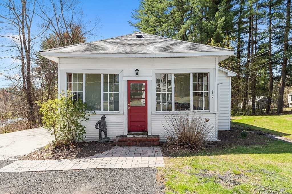 250 Brookside Road Orange, MA 01364 - Photo 2 of 30 a front view of a house with garden