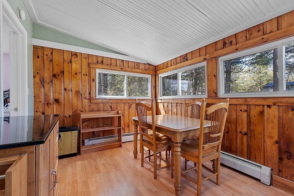250 Brookside Road Orange, MA 01364 - Photo 21 of 30 a view of a dining room with furniture window and wooden floor