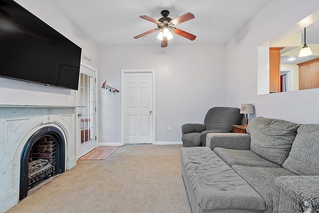250 Brookside Road Orange, MA 01364 - Photo 7 of 30 a living room with furniture and a fireplace