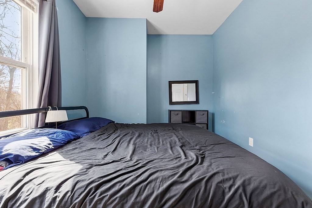 250 Brookside Road Orange, MA 01364 - Photo 10 of 30 a bedroom with a bed and a window