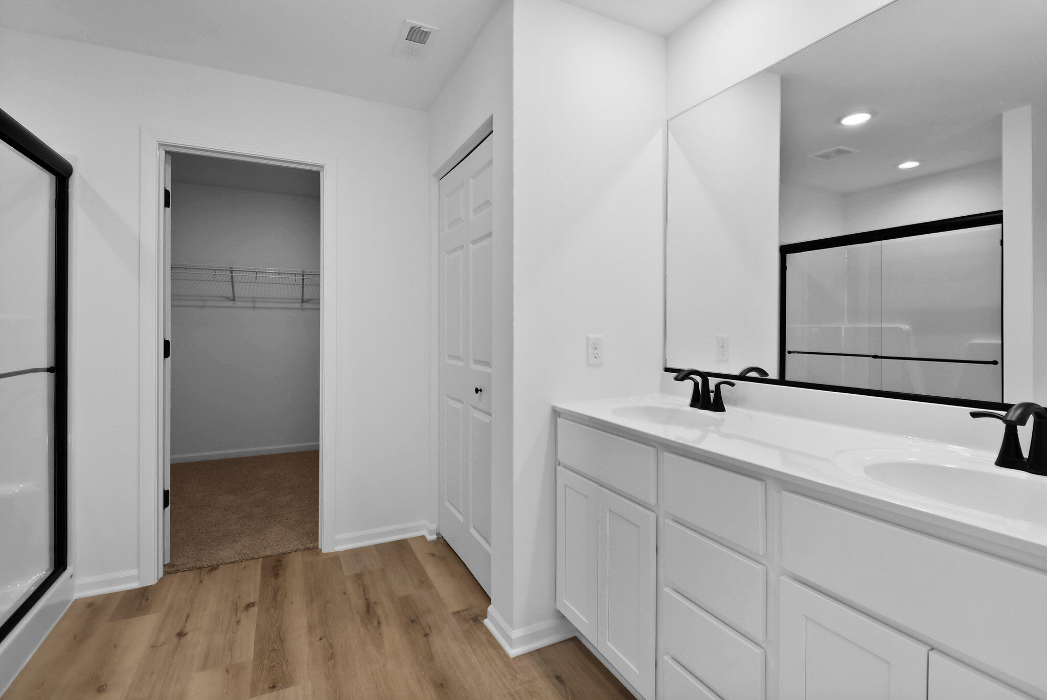 10410 California Street Crown Point, IN 46307 - Photo 14 of 24 a bathroom with a sink a toilet and mirror