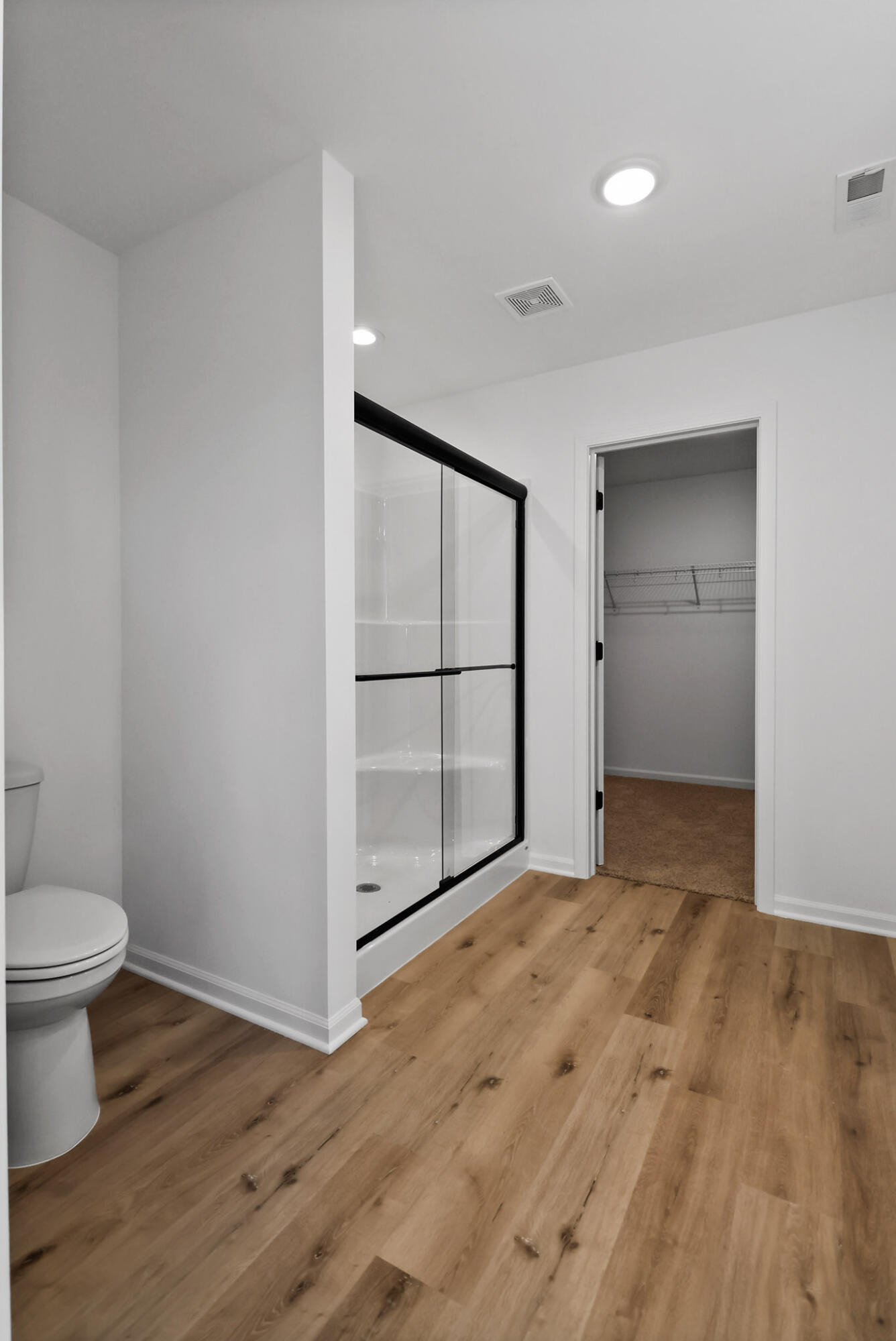 10410 California Street Crown Point, IN 46307 - Photo 21 of 24 a view of empty room with wooden floor and fan