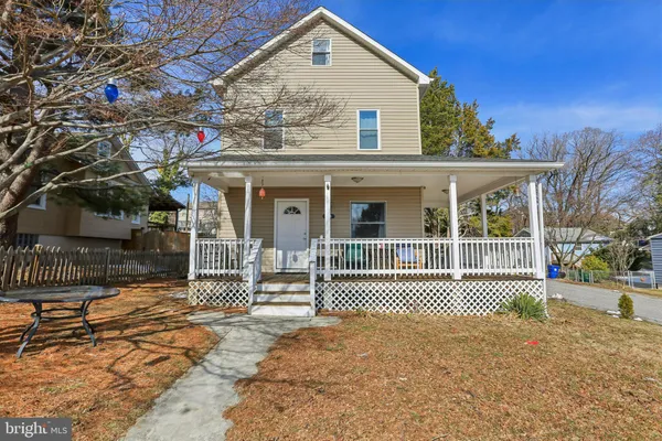 a front view of a house with a outdoor space