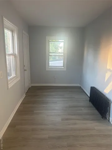 a stove top oven sitting inside of a kitchen